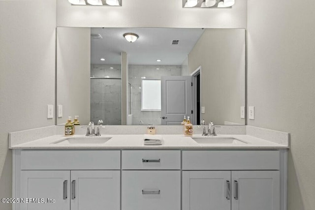 bathroom with vanity and an enclosed shower