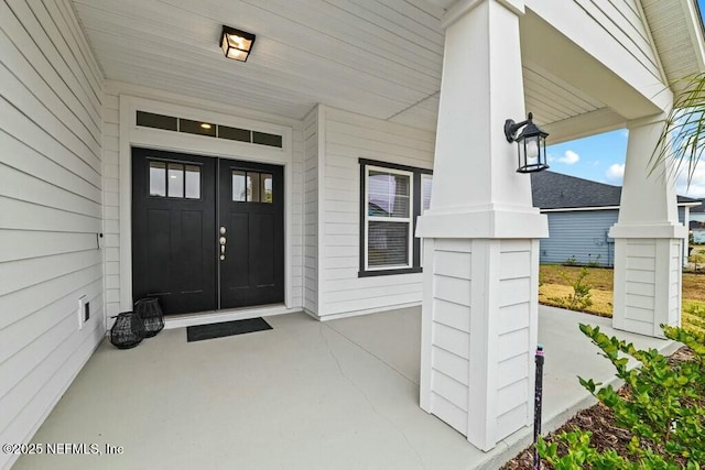 property entrance featuring a porch