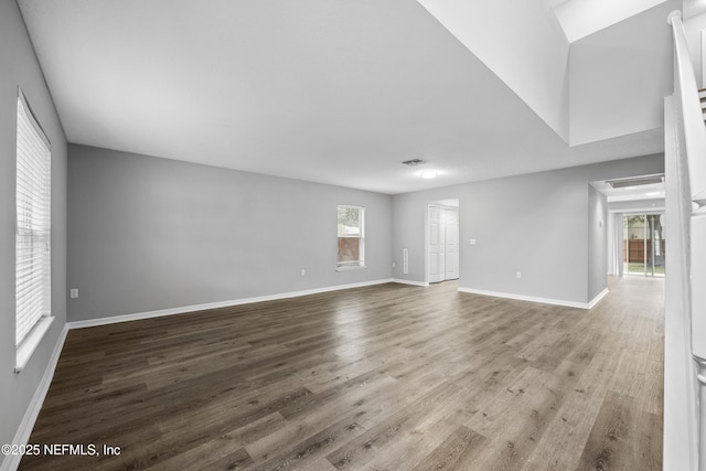 spare room with wood-type flooring