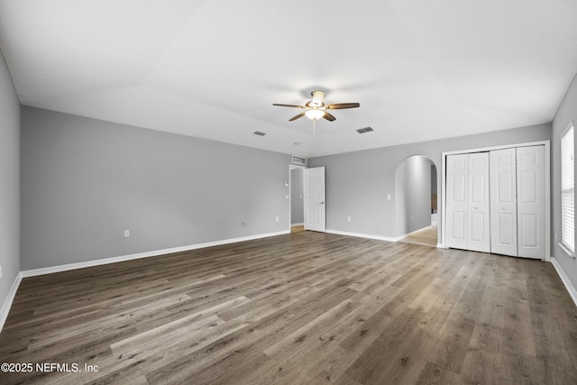 unfurnished bedroom with hardwood / wood-style flooring and ceiling fan