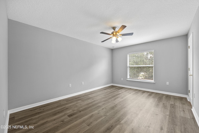 spare room with ceiling fan, wood-type flooring, and a textured ceiling