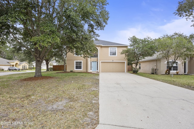 view of front of property featuring a garage and a front yard