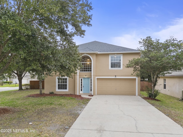 view of front of home with a garage and a front lawn