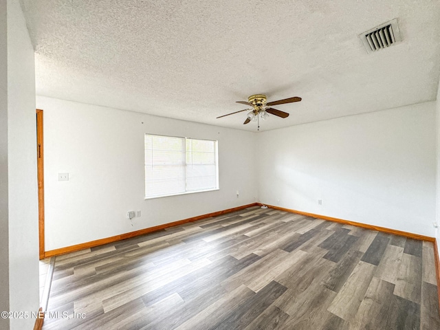 unfurnished room featuring ceiling fan, a textured ceiling, and hardwood / wood-style flooring