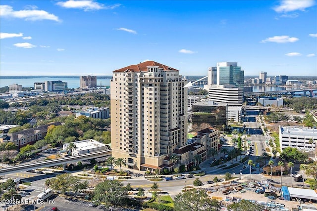 birds eye view of property with a water view