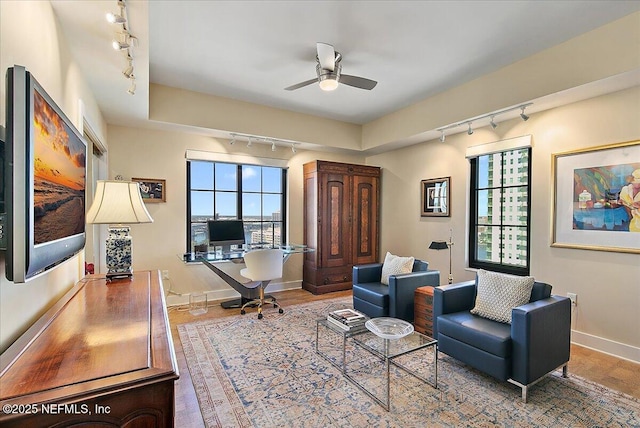 interior space featuring hardwood / wood-style floors and ceiling fan