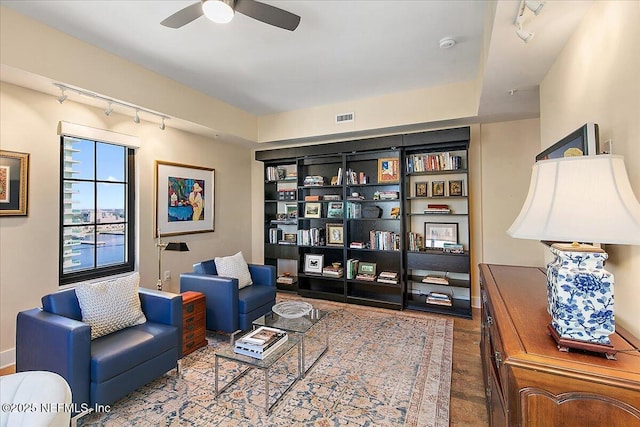 living area featuring ceiling fan