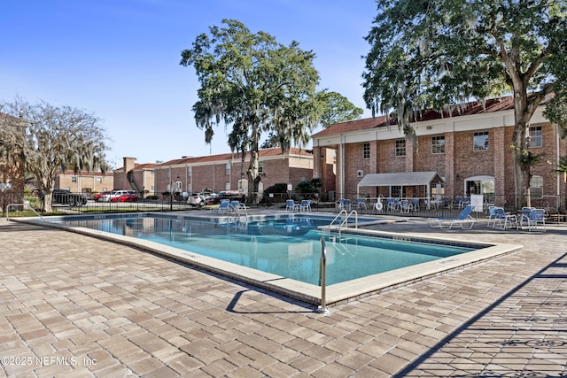 view of swimming pool with a patio