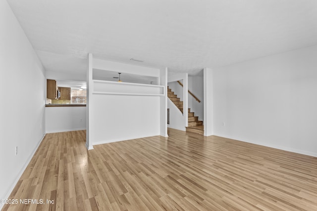 unfurnished living room featuring light wood-type flooring