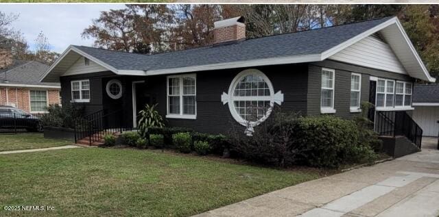 single story home with a front yard