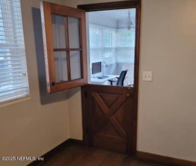 doorway to outside featuring dark hardwood / wood-style floors