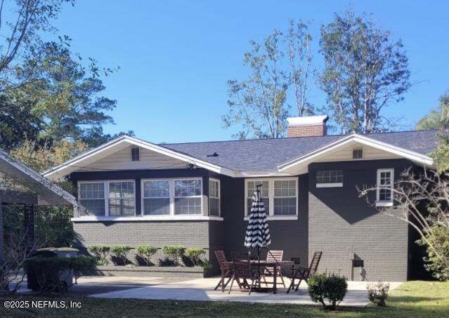 rear view of house featuring a patio area