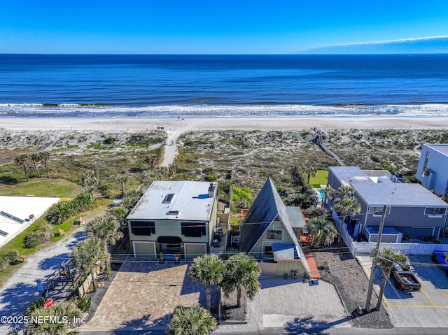 drone / aerial view featuring a view of the beach and a water view