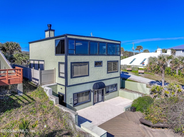 back of house featuring a deck