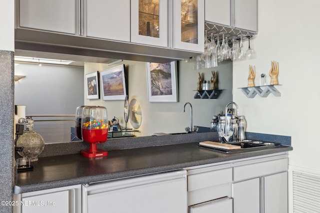 bar with white cabinetry