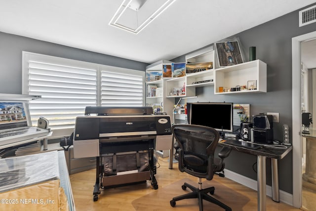 office area with light hardwood / wood-style floors