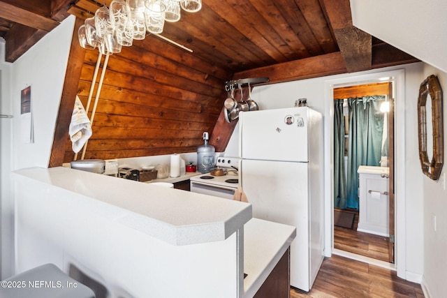 kitchen featuring wood ceiling, a chandelier, kitchen peninsula, white appliances, and hardwood / wood-style floors