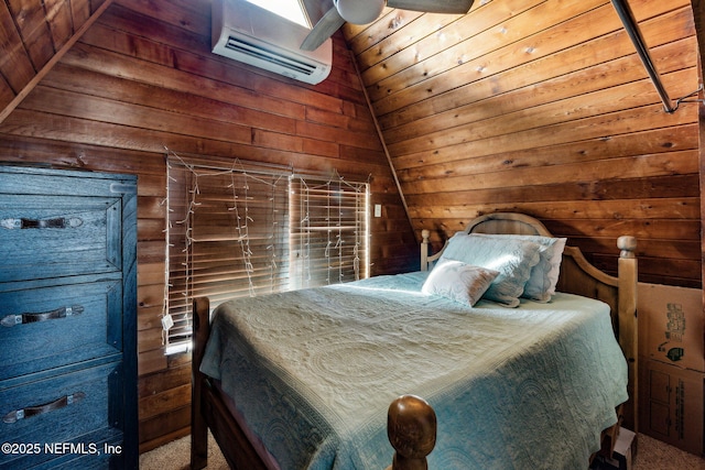 bedroom featuring lofted ceiling, a wall mounted air conditioner, and wooden walls