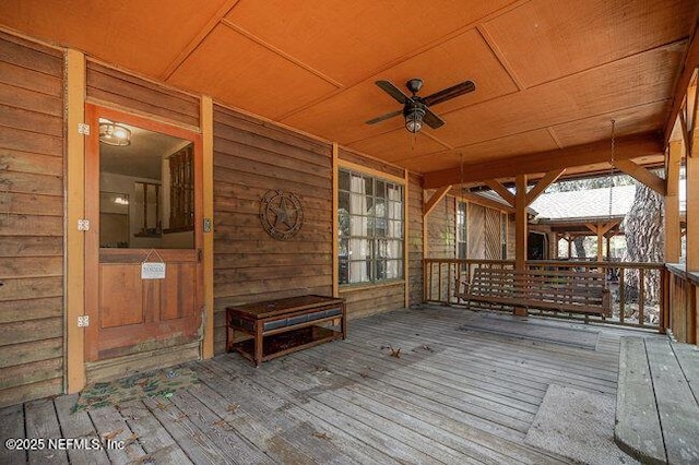 wooden deck with ceiling fan