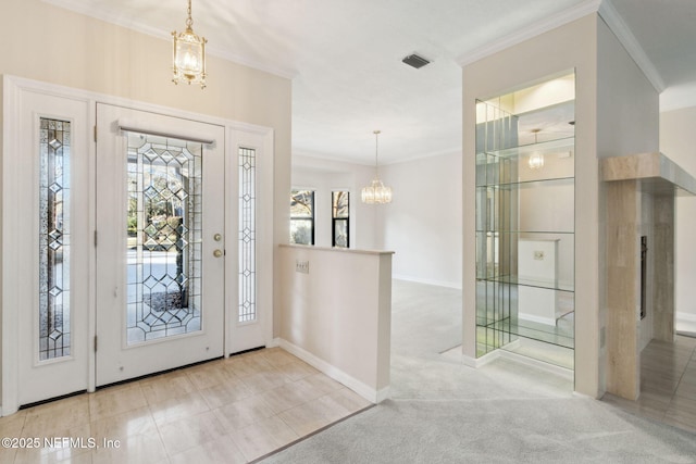 entryway featuring light colored carpet, ornamental molding, and a notable chandelier