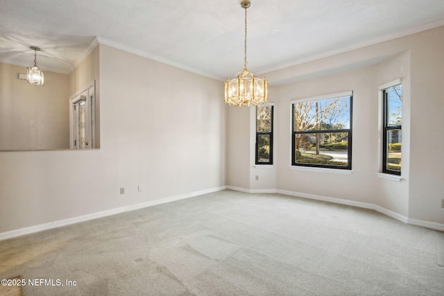 carpeted spare room with crown molding and a chandelier