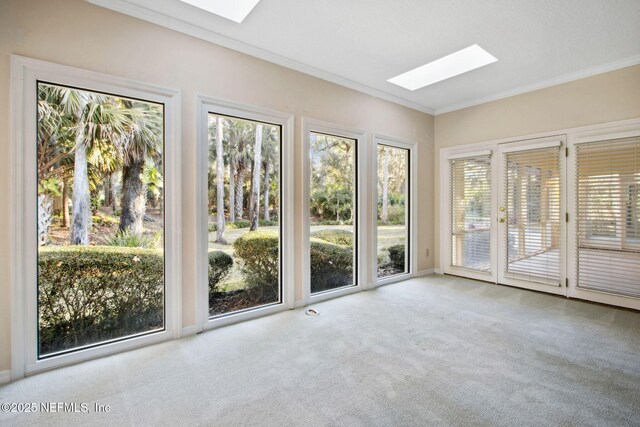 unfurnished sunroom featuring a skylight