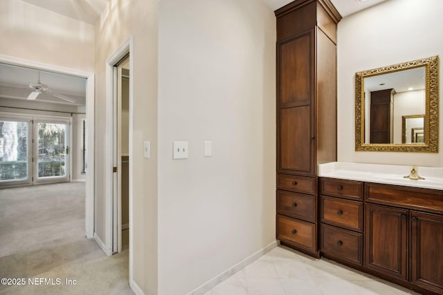 bathroom with ceiling fan and vanity