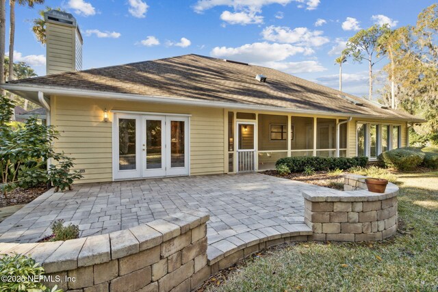 rear view of property featuring a patio and french doors