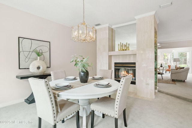 dining area featuring visible vents, ornamental molding, and light colored carpet