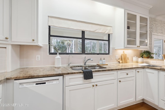 kitchen featuring white dishwasher, glass insert cabinets, and white cabinets