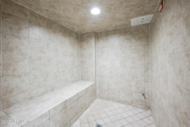 bathroom with tiled shower