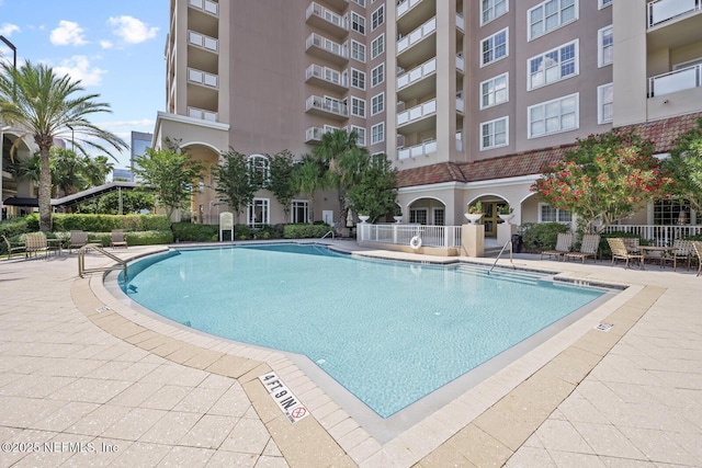 view of pool featuring a patio area