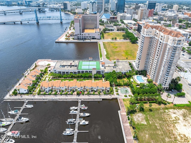 birds eye view of property with a water view