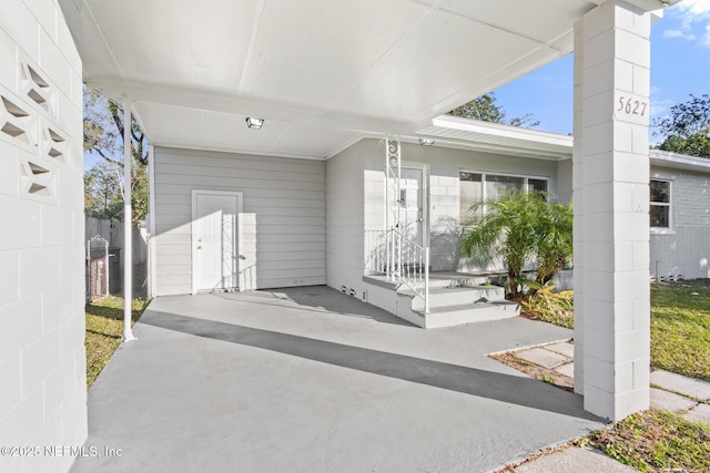 view of patio / terrace with a carport