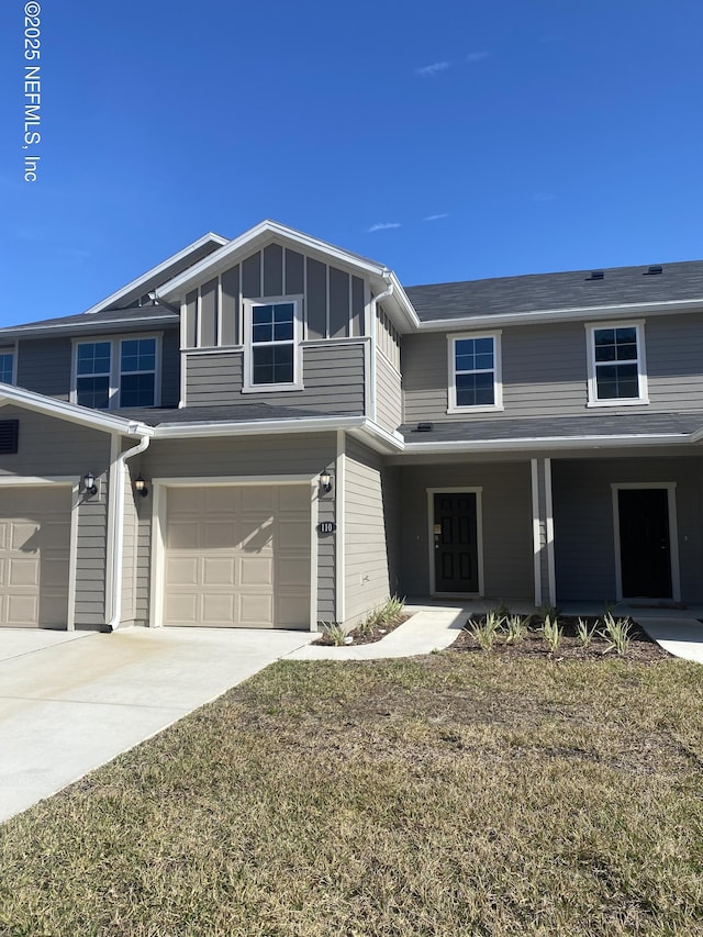 view of front of property with a garage and a front yard