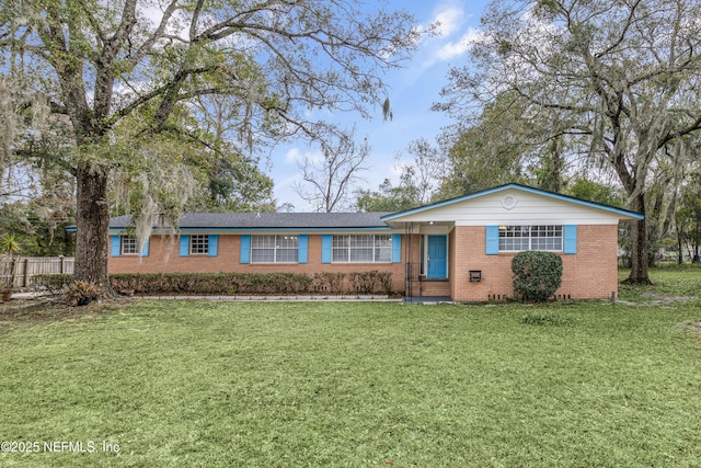 ranch-style house featuring a front lawn