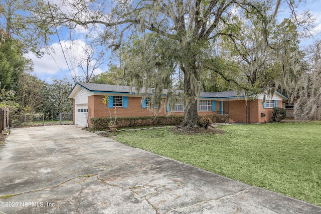 single story home featuring a front yard and a garage