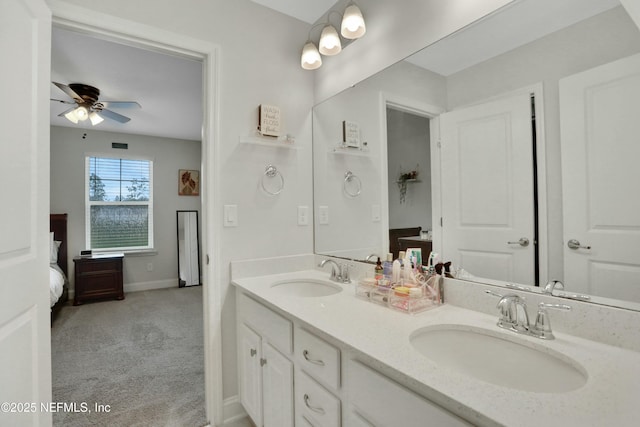 bathroom featuring ceiling fan and vanity