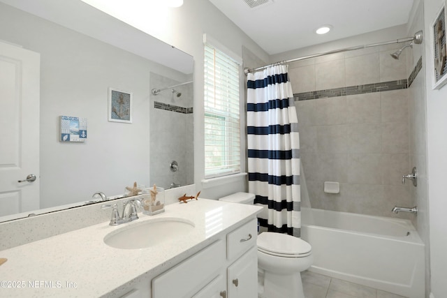 full bathroom with toilet, tile patterned floors, shower / tub combo with curtain, and vanity