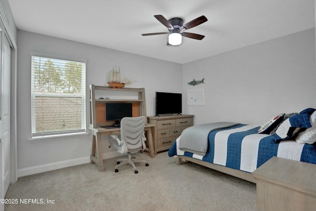 carpeted bedroom with a closet and ceiling fan