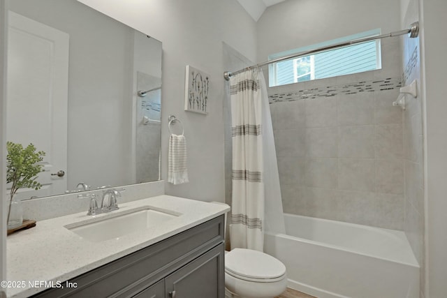 full bathroom featuring shower / tub combo, vanity, and toilet