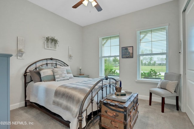 bedroom featuring light carpet and ceiling fan