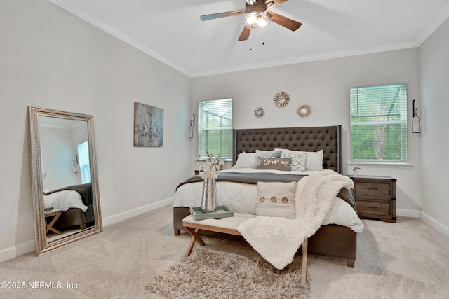 carpeted bedroom featuring ceiling fan and crown molding