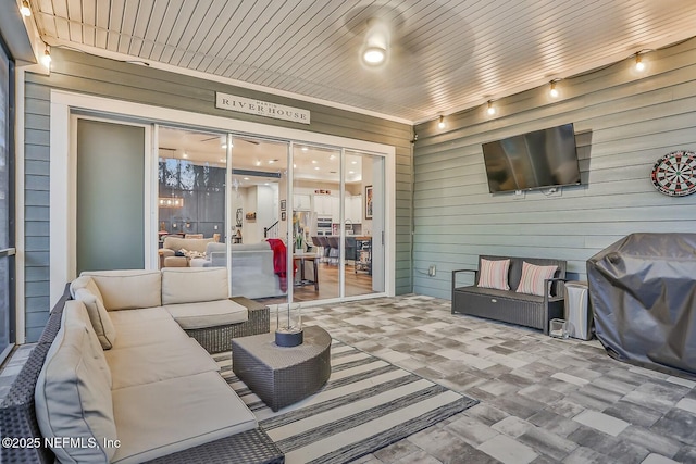 view of patio / terrace featuring an outdoor hangout area and a grill