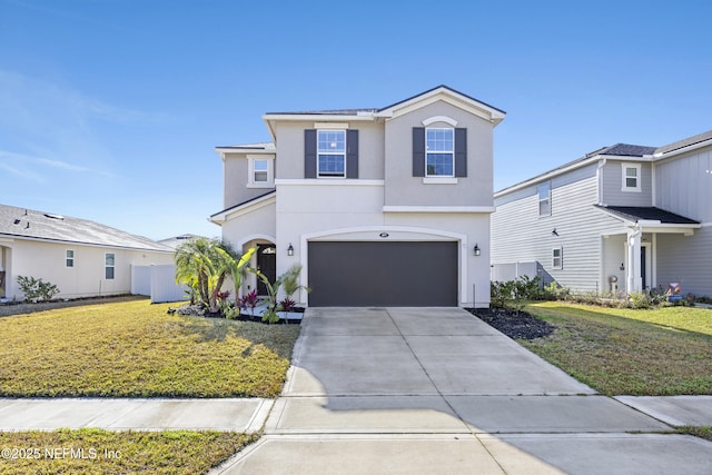 front of property with a garage and a front lawn