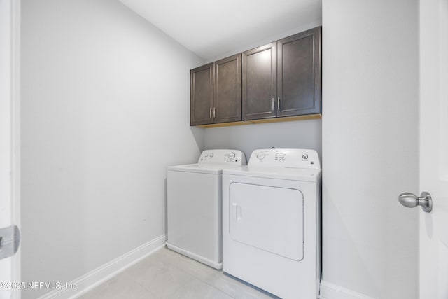 laundry room with cabinets and independent washer and dryer