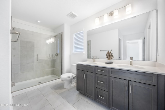 bathroom featuring tile patterned floors, an enclosed shower, vanity, and toilet