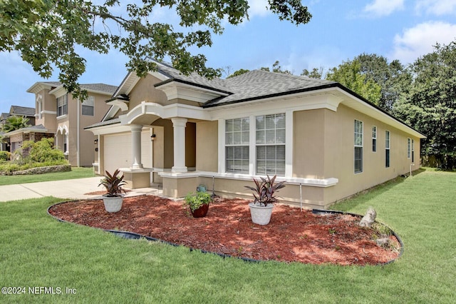 view of front facade featuring a garage and a front lawn