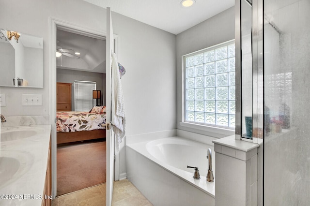 bathroom featuring ceiling fan, separate shower and tub, tile patterned flooring, and vanity