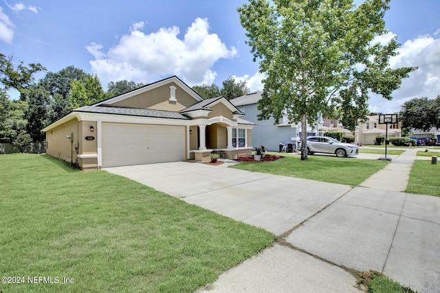 view of front facade with a garage and a front lawn